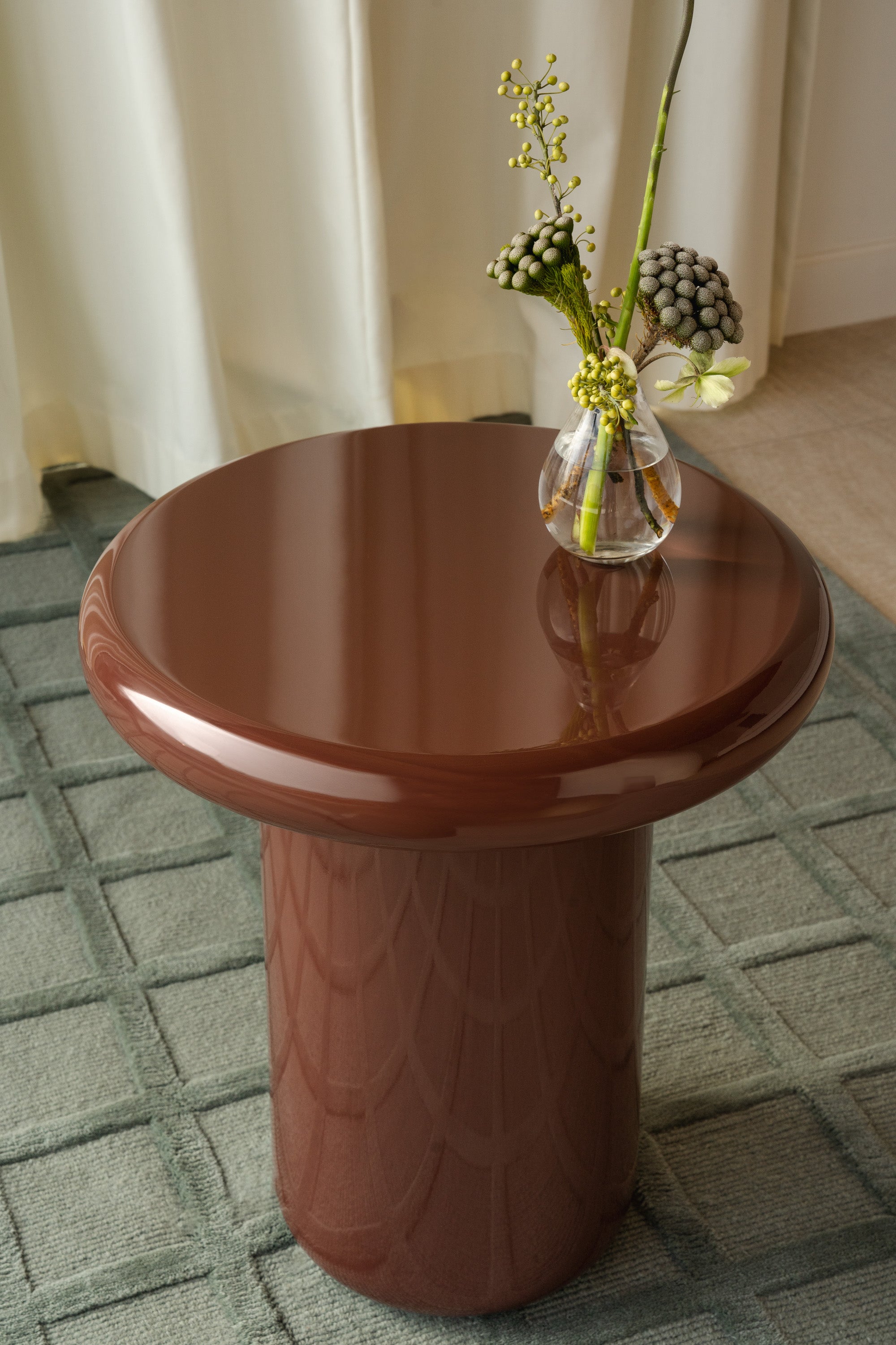 Mieux Mile side table in Merlot (deep red) gloss displayed in a modern living room