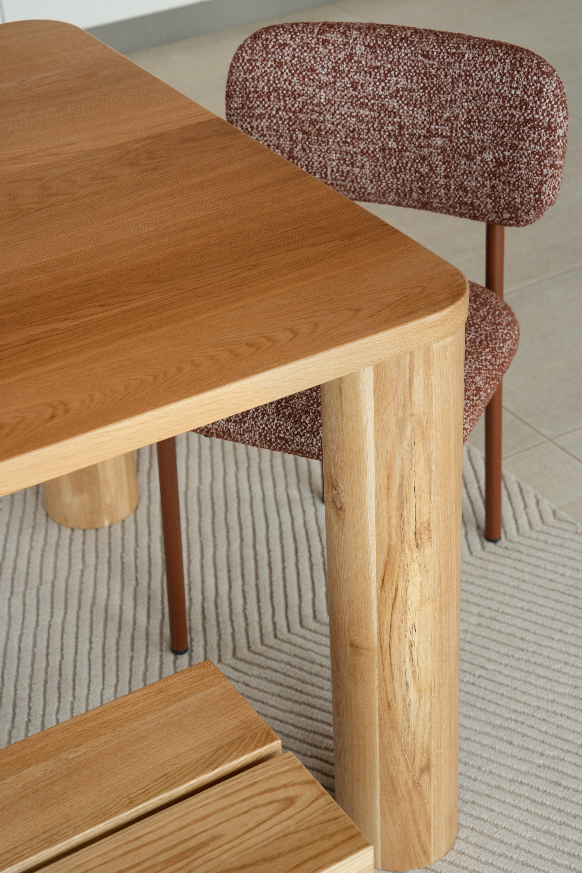 Close-up of Mieux Tema oak dining table in a modern dining room