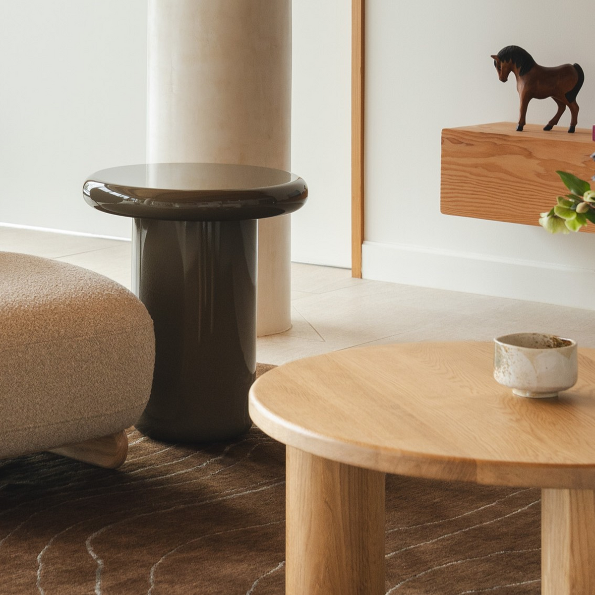Mieux Champi side table in olive gloss displayed in a modern living room
