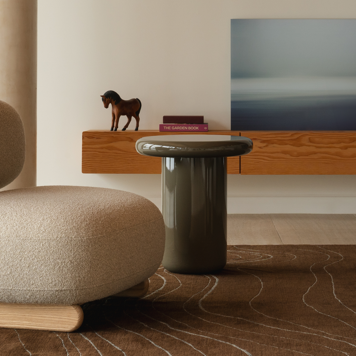Mieux Champi side table in olive gloss displayed in a modern living room