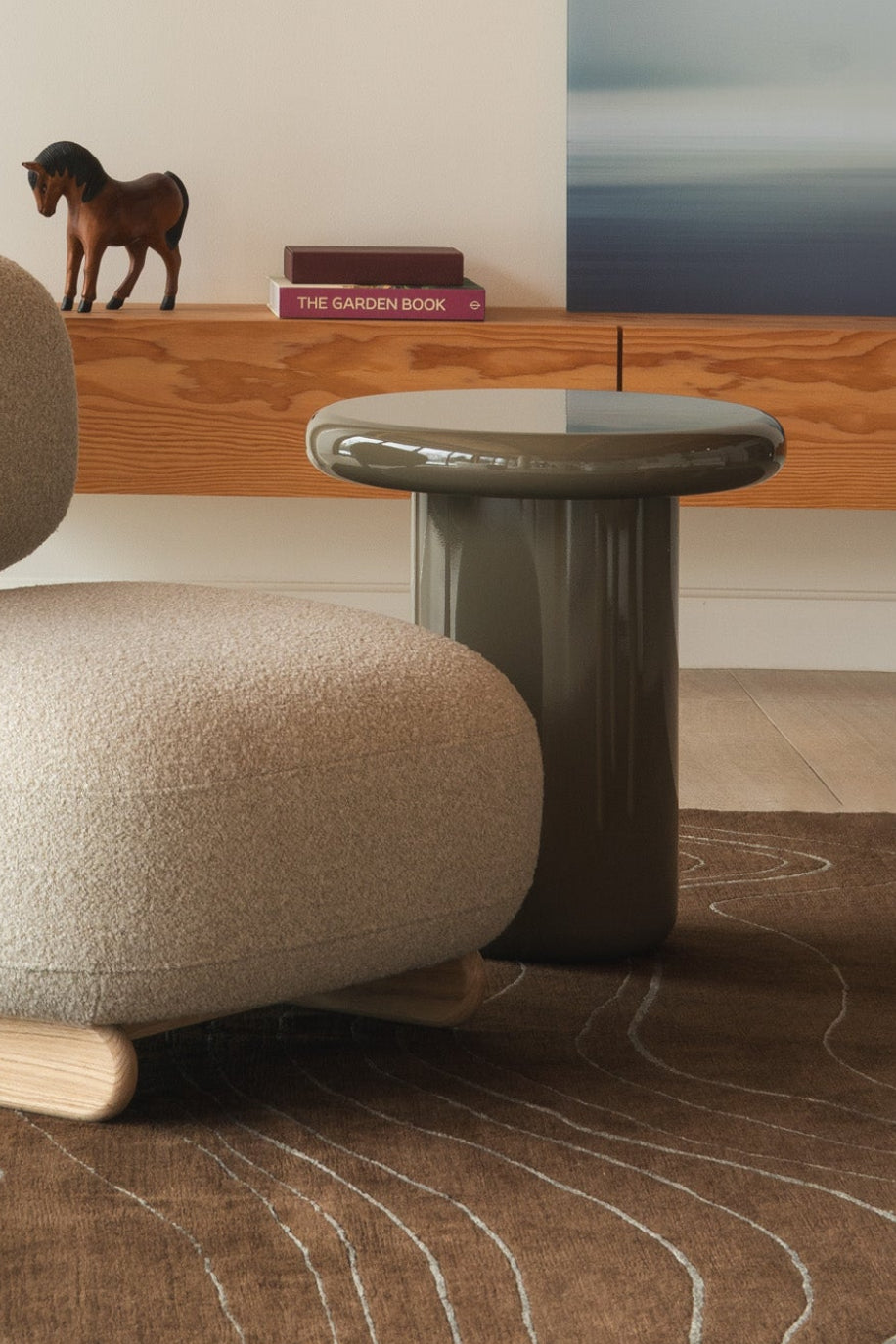 Mieux Mile side table in olive gloss displayed in a modern living room