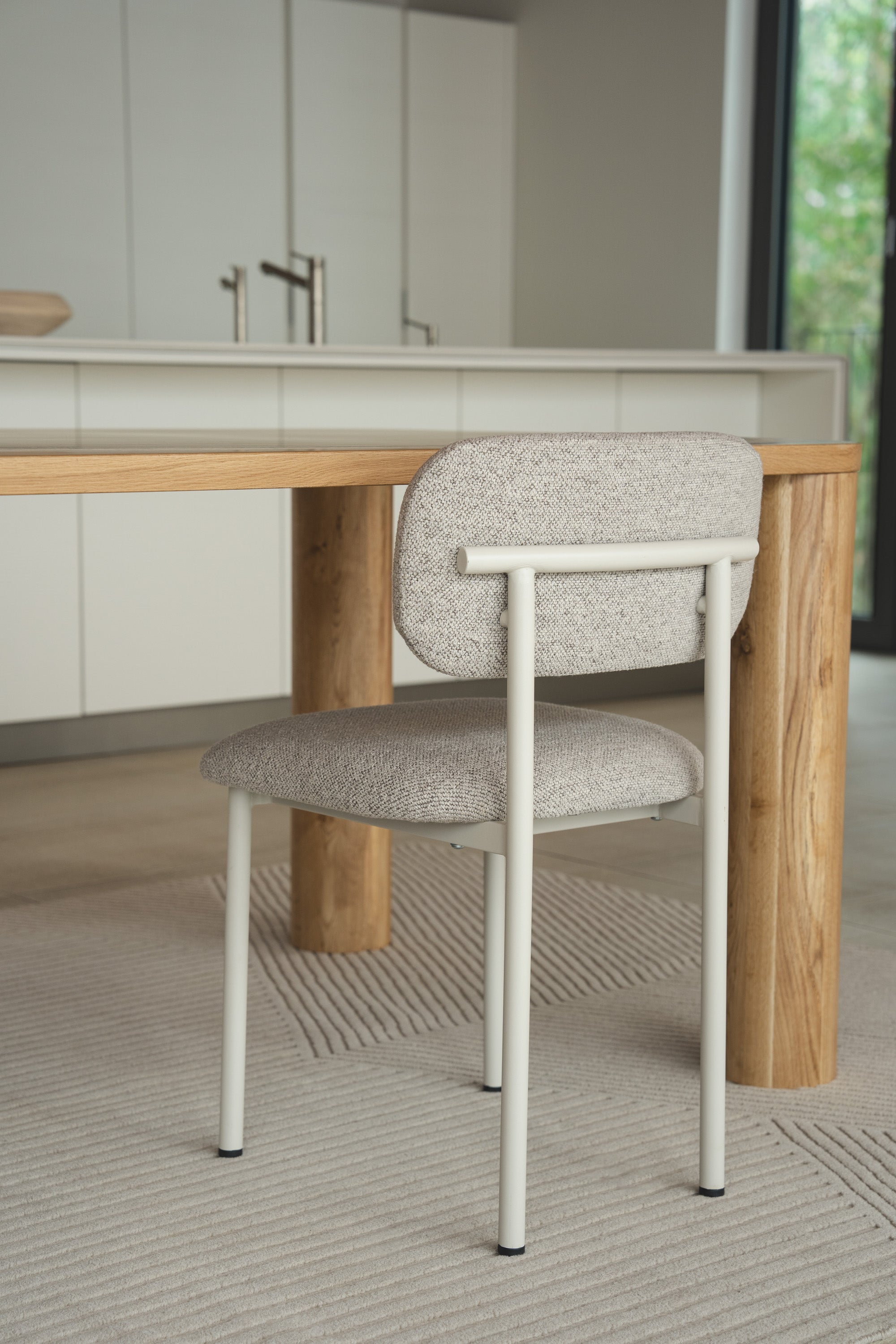 Mieux Ray dining chair in greige displayed in a modern dining room